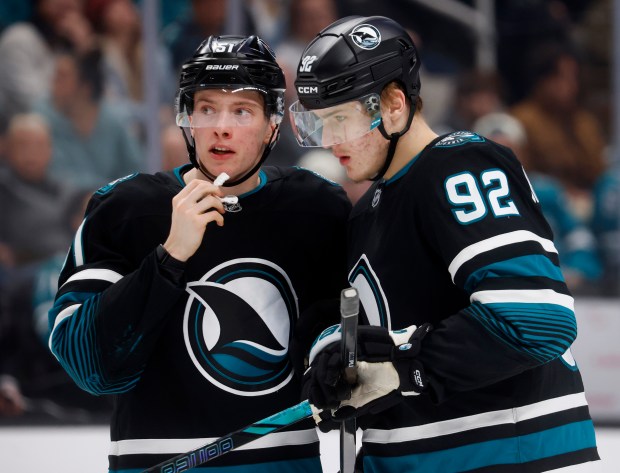 San Jose Sharks' Igor Chernyshov (92) chats with San Jose Sharks' Collin Graf (51) during their game against the Calgary Flames in the third period at the SAP Center in San Jose, Calif., on Tuesday, Dec. 16, 2025. (Nhat V. Meyer/Bay Area News Group)