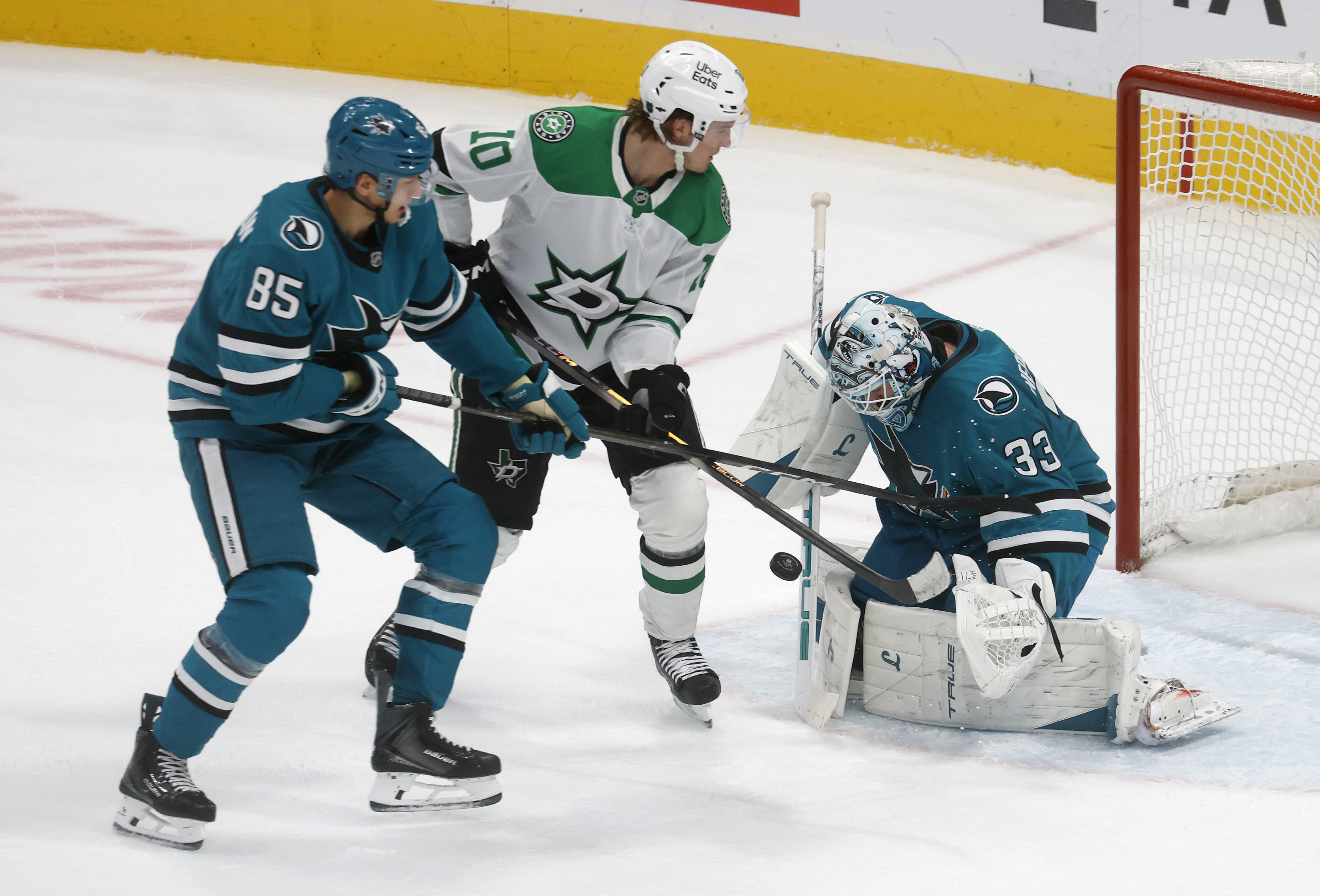 San Jose Sharks goaltender Alex Nedeljkovic (33) blocks a shot...