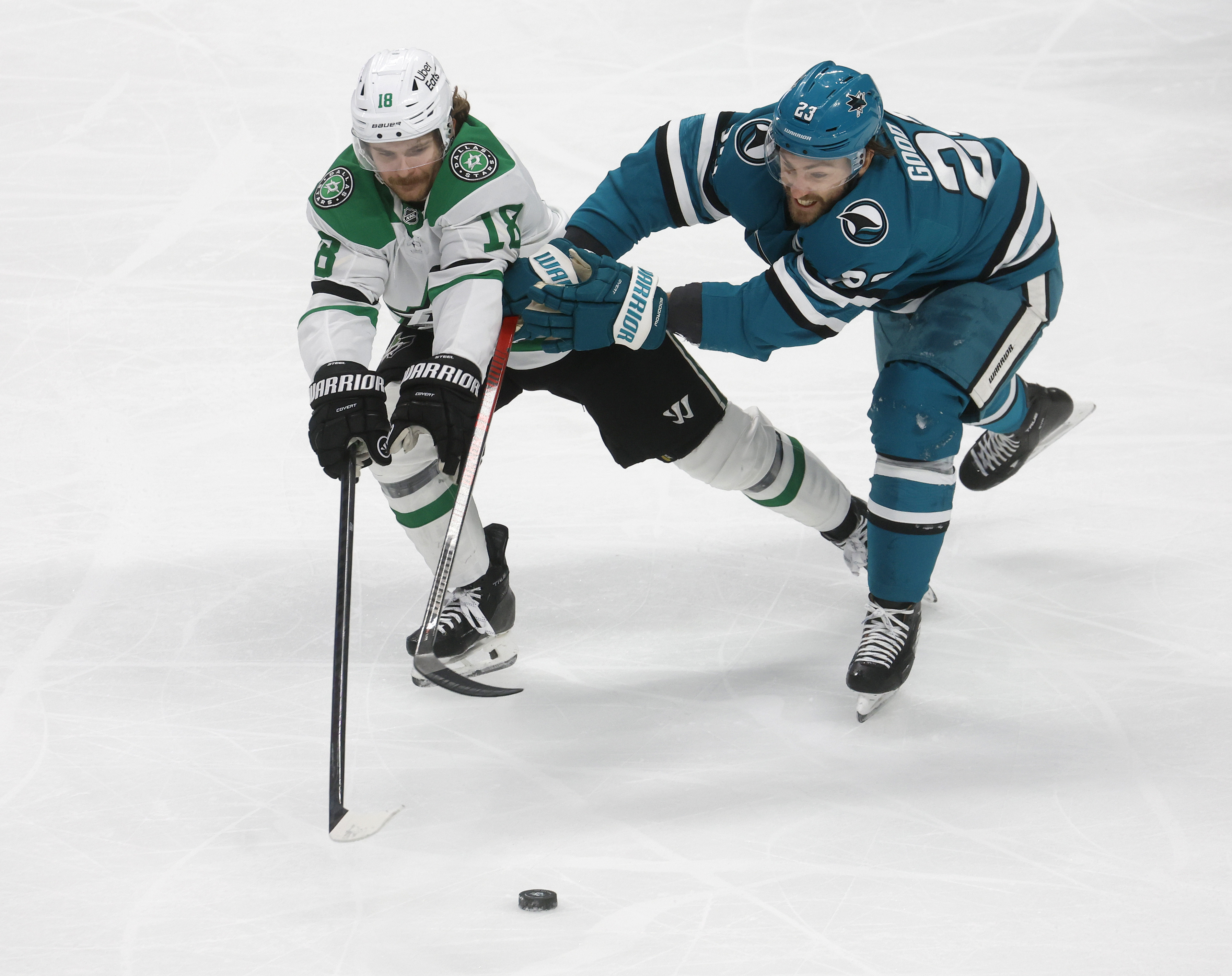 San Jose Sharks’ Barclay Goodrow (23) fights for the puck...