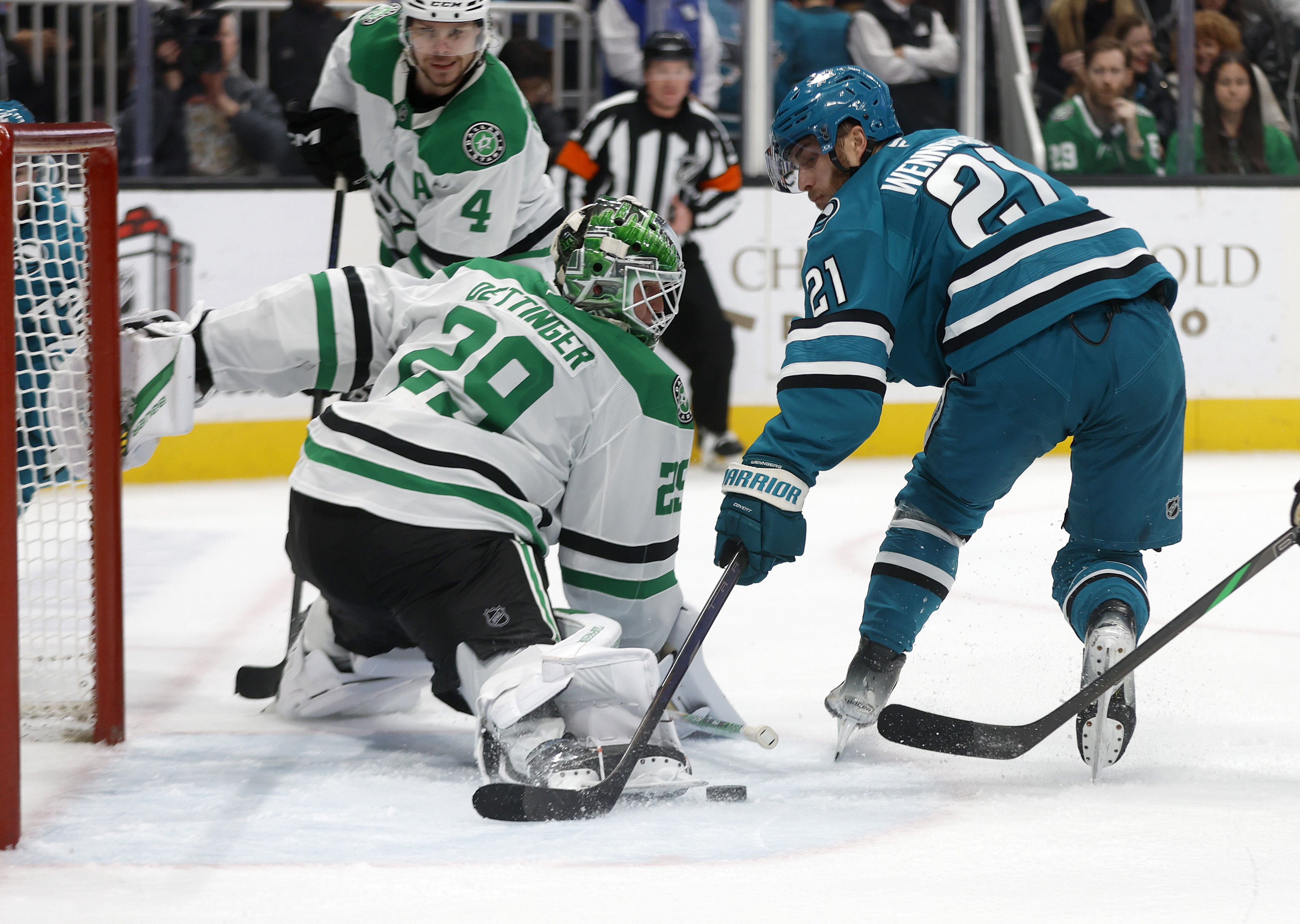 San Jose Sharks’ Alexander Wennberg (21) canât get a shot...