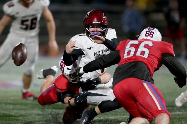 Monte Vista quarterback Ian Ondricek's second half fumble against St. Ignatius is recovered by the Mustangs during the CIF NorCal Division 3-AA championship game on Friday, Dec. 5, 2025, at St. Ignatius College Preparatory in San Francisco, Calif. (Karl Mondon for the Bay Area News Group)