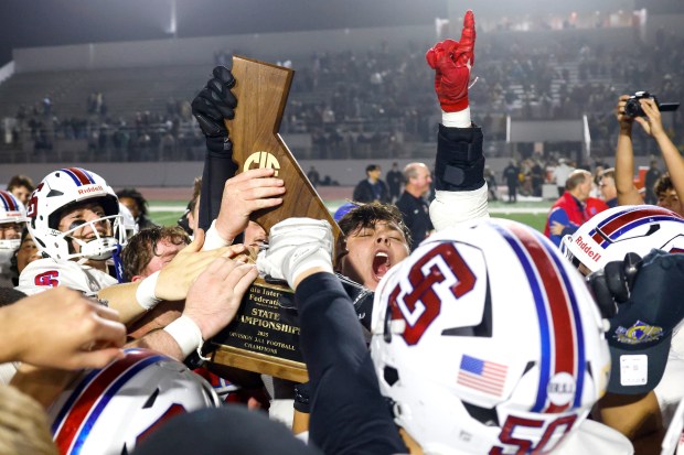 St. Ignatius celebrates after winning against Ventura during the Division 3-AA state championship football game at Fullerton Union High School District Stadium in Fullerton, Calif., on Friday, Dec. 12, 2025. (Shae Hammond/Bay Area News Group)