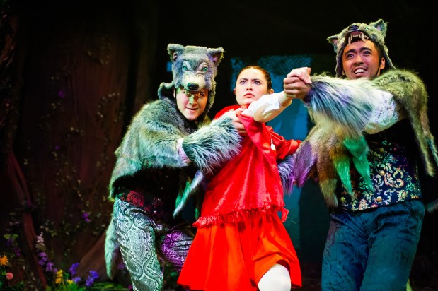 Little Red Riding Hood (Olivia Hellman) is ambushed by two wolves (Trevor March, left, and Johann Santiago Santos) in SF Playhouse's "Into the Woods," running through Jan. 17. (Photo by Jessica Palopoli / SF Playhouse)