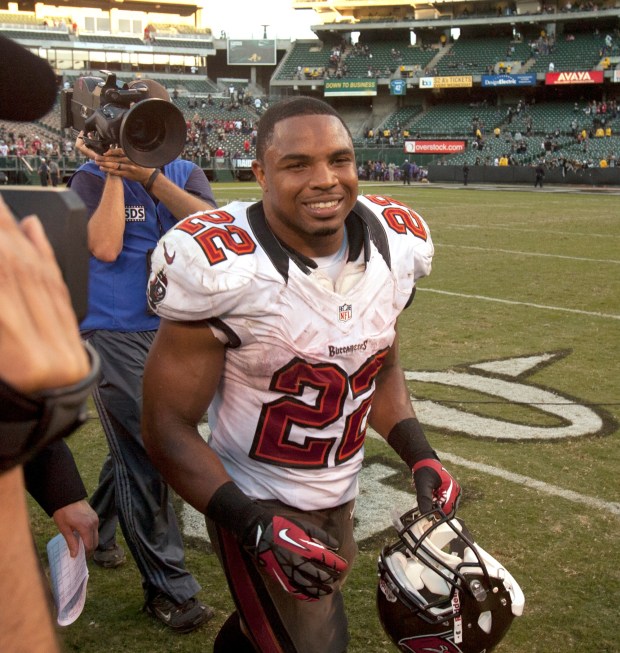 Tampa Bay Buccaneers running back Doug Martin (22) walks off the field after a staggeringly successful day against the Oakland Raiders in an NFL football game, Sunday, Nov. 4, 2012 at O.co Coliseum in Oakland, Calif. Martin rushed for 251 yards and four touchdowns, as the Buccaneers won, 42-32. (D. Ross Cameron/Staff)