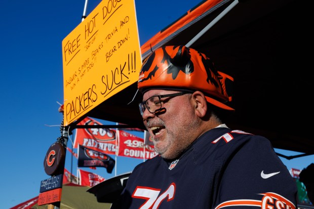 Jesse Gervantes gives out free hotdogs to tailgaters before the Bears play the 49ers on Sunday, Dec. 28, 2025, at Levi's Stadium in Santa Clara, Calif. (Armando L. Sanchez/Chicago Tribune)