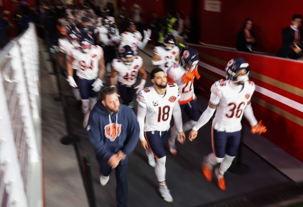 Bears quarterback Caleb Williams (18) and teammates head to the field for a game against the 49ers on Sunday, Dec. 28, 2025, at Levi's Stadium in Santa Clara, Calif. (John J. Kim/Chicago Tribune)