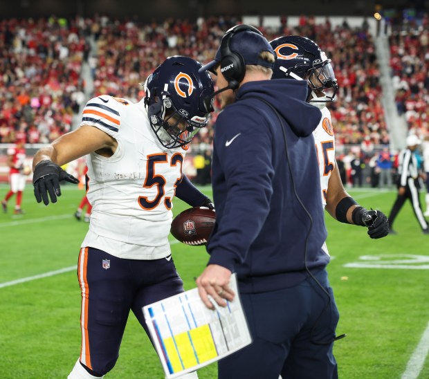 Bears linebacker T.J. Edwards is congratulated by coach Ben Johnson after a pick-six on the first play from scrimmage against the 49ers on Sunday, Dec. 28, 2025, at Levi's Stadium in Santa Clara, Calif. (John J. Kim/Chicago Tribune)