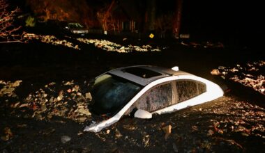 A car sits buried in mud after flooding Wednesday, Dec. 24, 2025, in Wrightwood, Calif. (AP Photo/Wally Skalij)