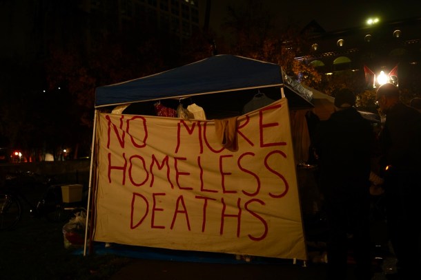A banner adorns a pop-up shade structure. Neenma Ebeledike, OBSERVER