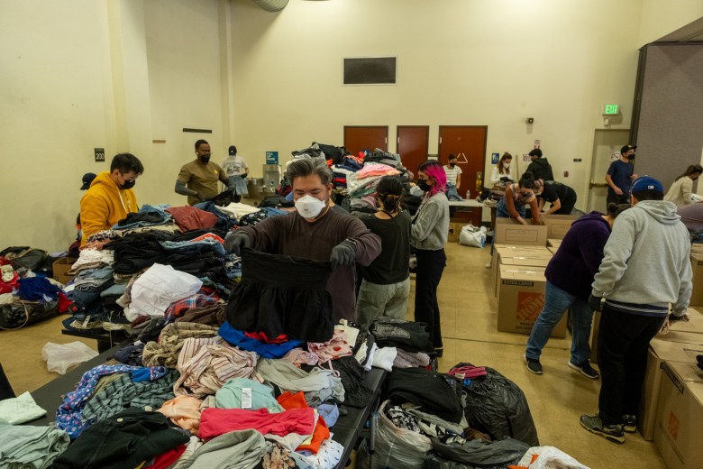 A man sorts through donations
