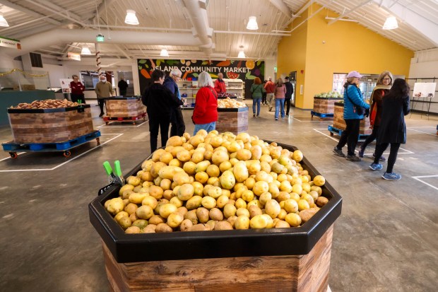 Visitors tour the new Alameda Food Bank location during the open house in Alameda, Calif., on Saturday, Dec. 13, 2025. (Ray Chavez/Bay Area News Group)