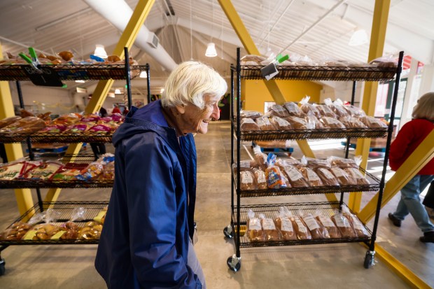 Donor Sally Faulhaber, of Alameda, tours the new Alameda Food Bank location during the open house in Alameda, Calif., on Saturday, Dec. 13, 2025. (Ray Chavez/Bay Area News Group)