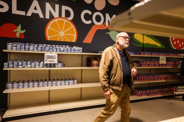 John Hamilton, of Meals on Wheels, tours the new Alameda Food Bank location during an open house in Alameda, Calif., on Saturday, Dec. 13, 2025. (Ray Chavez/Bay Area News Group)