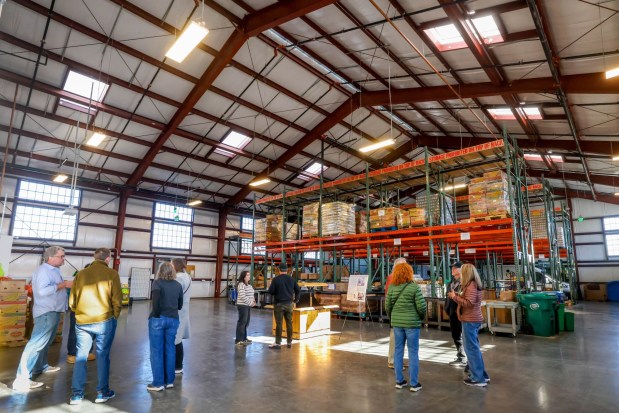 Visitors tour the new Alameda Food Bank location during the open house in Alameda, Calif., on Saturday, Dec. 13, 2025. (Ray Chavez/Bay Area News Group)