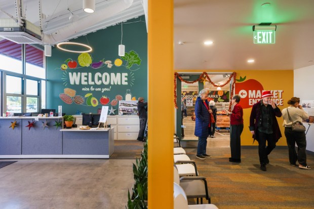 Visitors tour the new Alameda Food Bank location during the open house in Alameda, Calif., on Saturday, Dec. 13, 2025. (Ray Chavez/Bay Area News Group)
