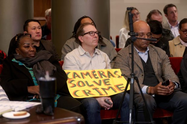 Community members listen during an Oakland City Council meeting at City Hall in Oakland, Calif., on Tuesday, Dec. 16, 2025. The Oakland City Council voted 7-1 to award Flock Safety a new contract to maintain an existing network of 300 cameras in the city. (Jane Tyska/Bay Area News Group)