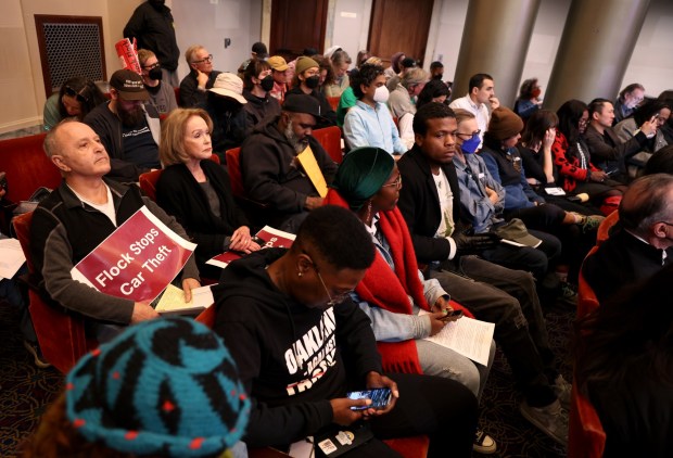 Community members listen during an Oakland City Council meeting at City Hall in Oakland, Calif., on Tuesday, Dec. 16, 2025. The Oakland City Council voted 7-1 to award Flock Safety a new contract to maintain an existing network of 300 cameras in the city. (Jane Tyska/Bay Area News Group)