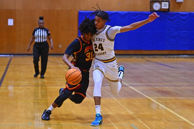 King's Academy's Boss Mhoon (24) guards AIMS College Prep's Marcell Saliba-Coffey (12) in the fourth period of their game during the Damian Lillard Classic at Oakland High School in Oakland, Calif., on Friday, Dec. 26, 2025. King's Academy defeated AIMS 93-25. (Jose Carlos Fajardo/Bay Area News Group)