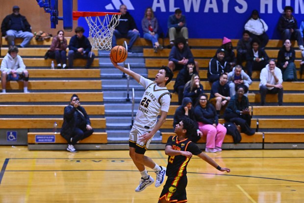 King's Academy's Nathan Hong (25) goes up for a layup past AIMS College Prep's Amr Aldhanebi (2) in the first period of their game during the Damian Lillard Classic at Oakland High School in Oakland, Calif., on Friday, Dec. 26, 2025. (Jose Carlos Fajardo/Bay Area News Group)