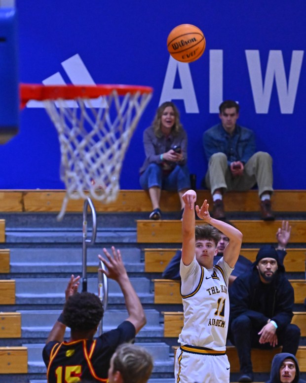 King's Academy's Claxton Ladine (11) makes a three-point basket against AIMS College Prep in the first period of their game during the Damian Lillard Classic at Oakland High School in Oakland, Calif., on Friday, Dec. 26, 2025. Ladine would make 11 three-point baskets and a total of 35 points. (Jose Carlos Fajardo/Bay Area News Group)