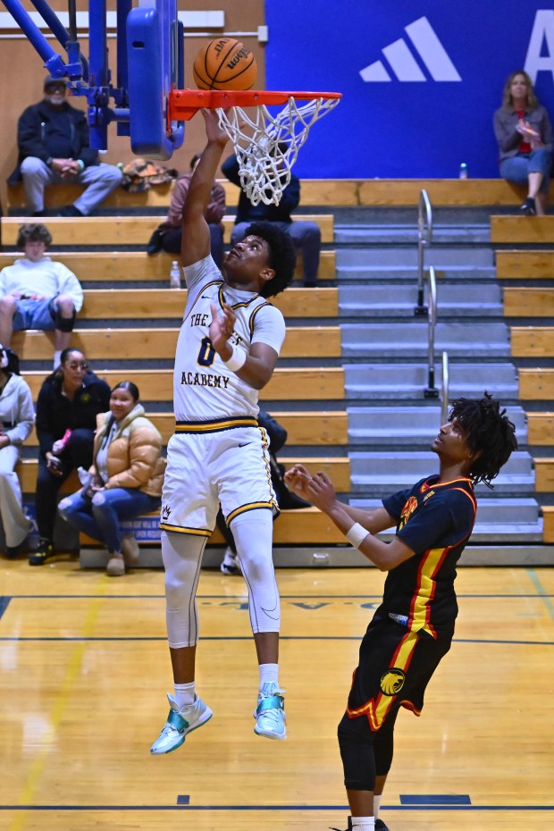 King's Academy's Adrian Barnett (0) goes up for a layup against AIMS College Prep's Isaac Abram (31) in the first period of their game during the Damian Lillard Classic at Oakland High School in Oakland, Calif., on Friday, Dec. 26, 2025. (Jose Carlos Fajardo/Bay Area News Group)