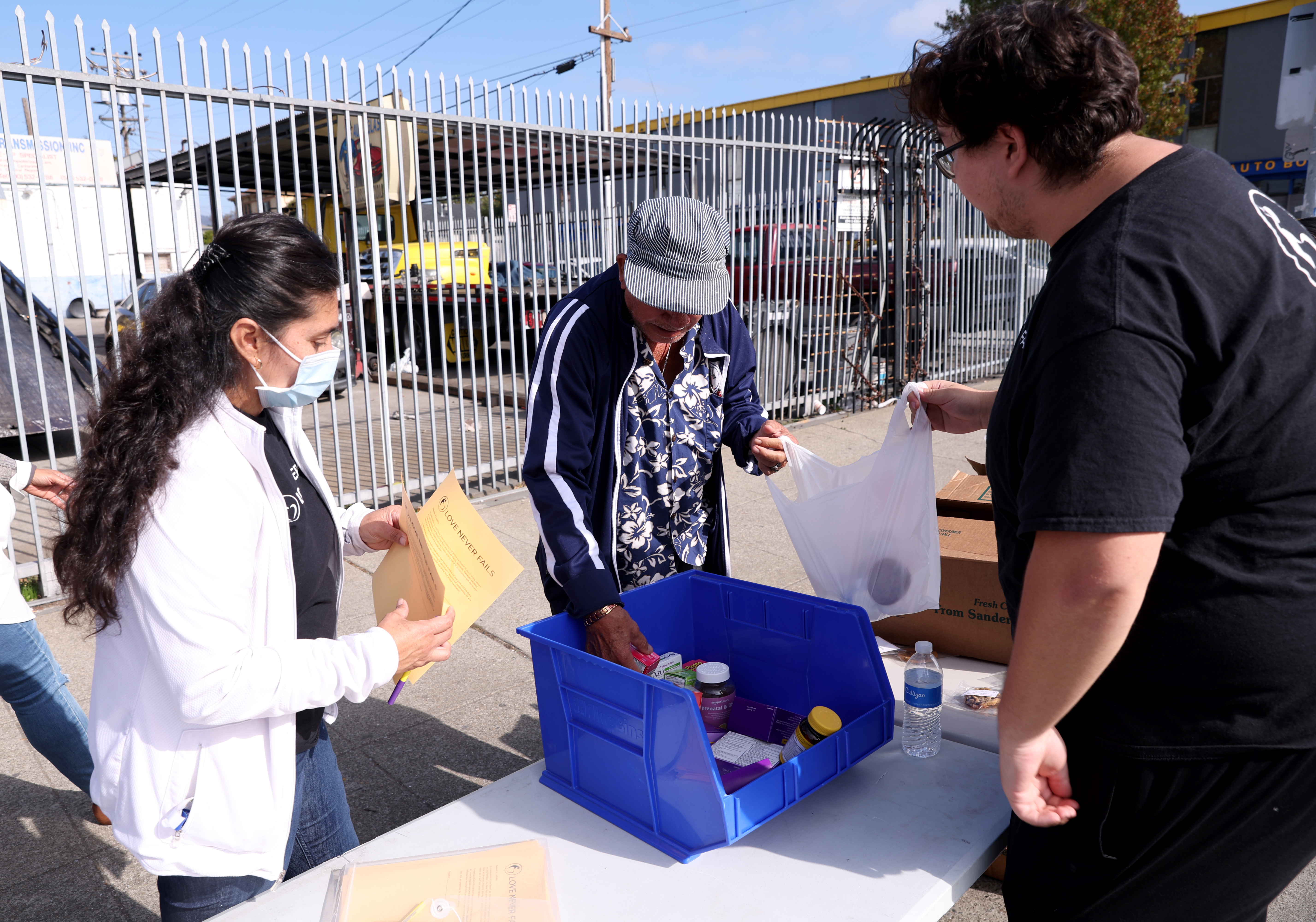 Love Never Fails staff member Reyna Flores and volunteer Justin...