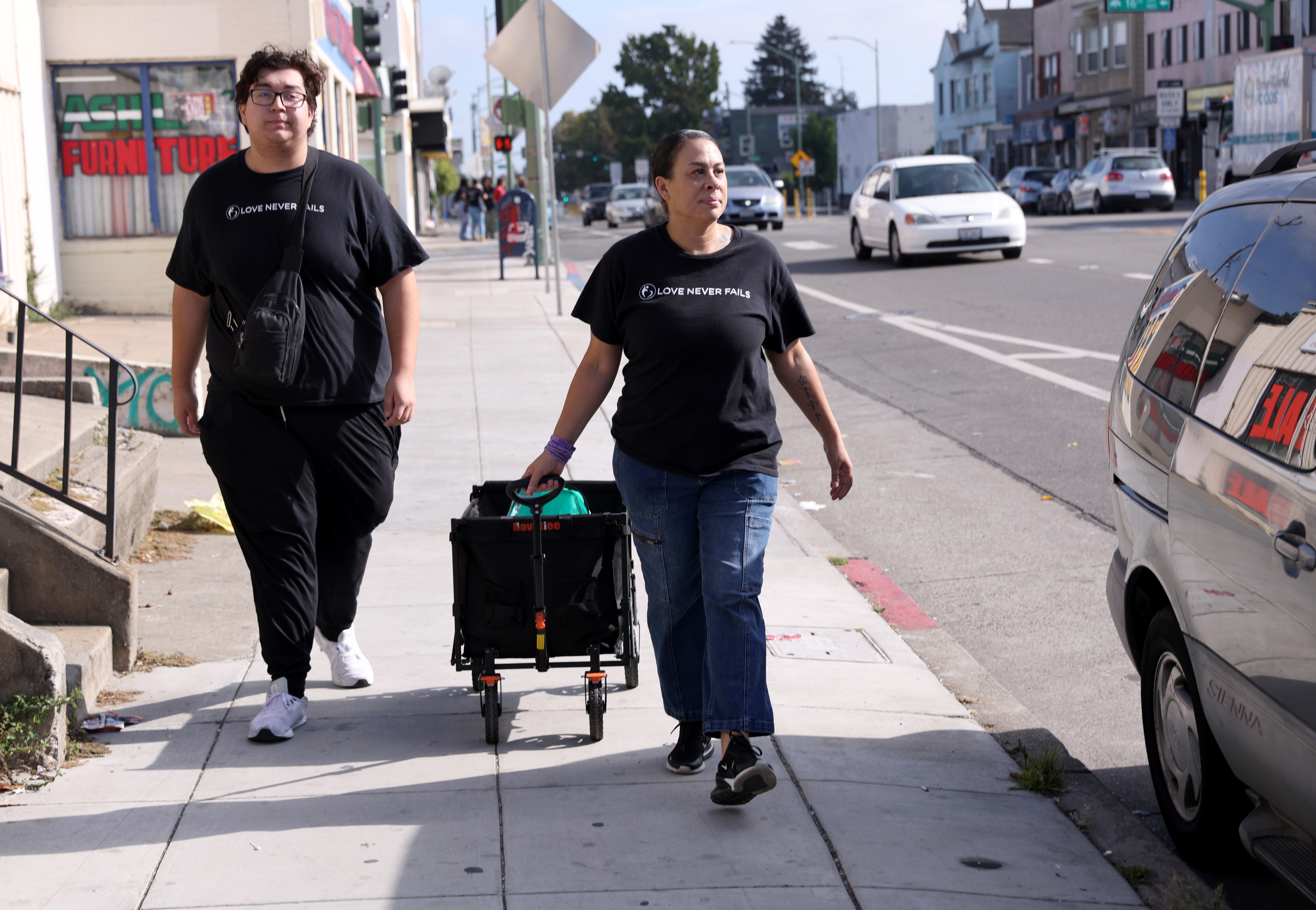 Love Never Fails staff member Leanette Guillory-Higuera and volunteer Justin...