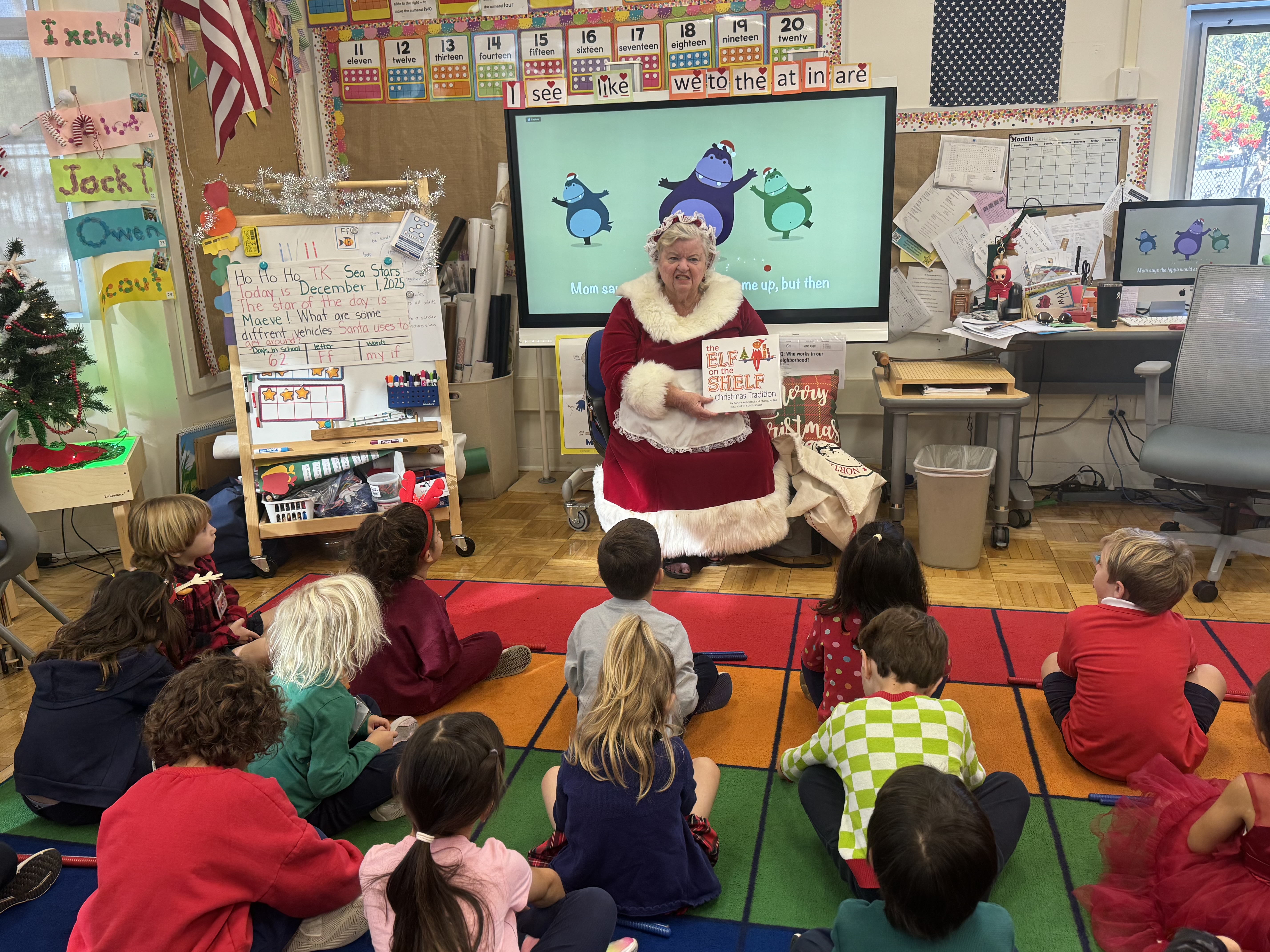 Columnist Jo Murray reads a holiday book to TK students...
