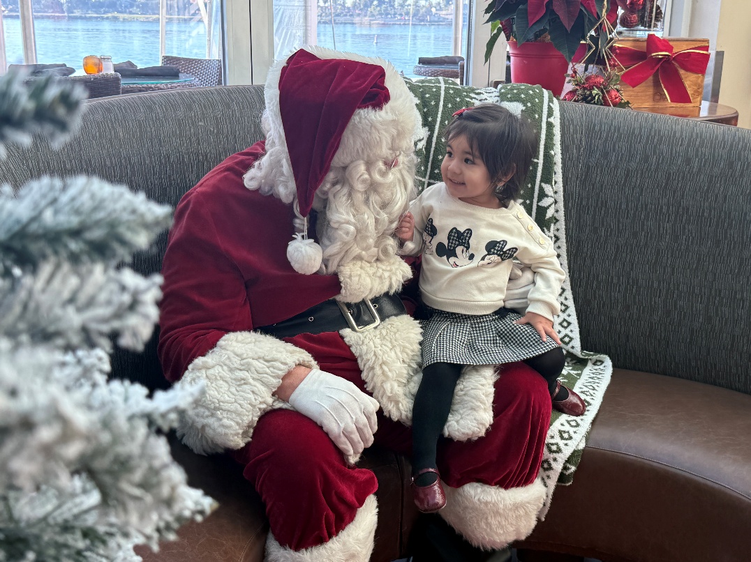 A little girl beams with joy while spending time with...