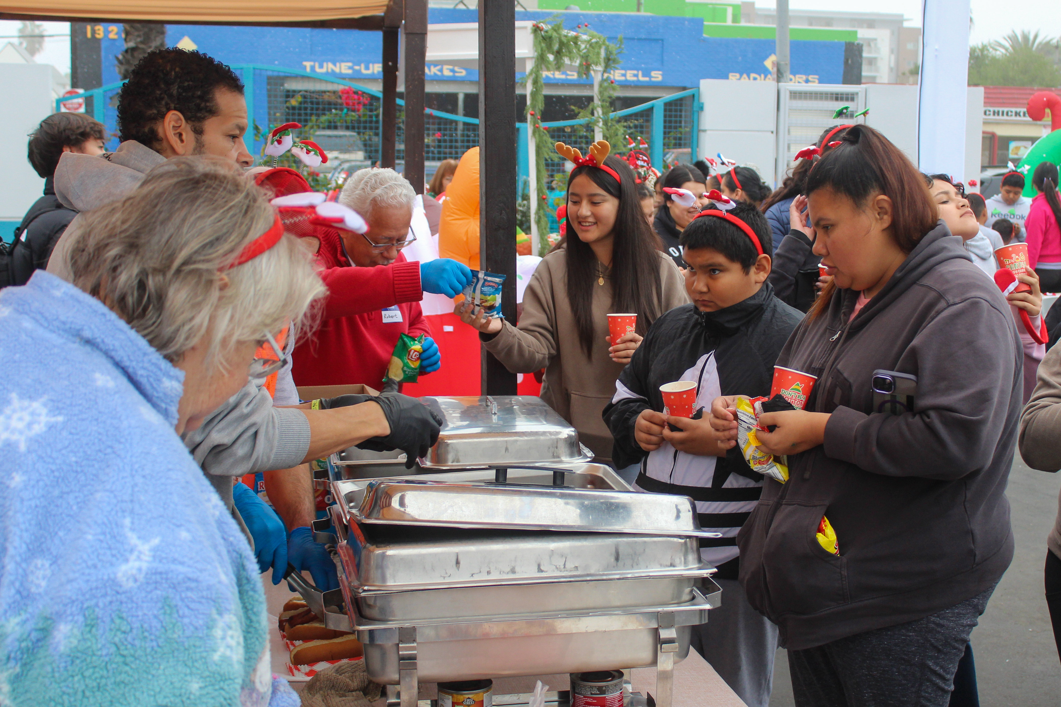 Hundreds of children and their families received food and drinks...