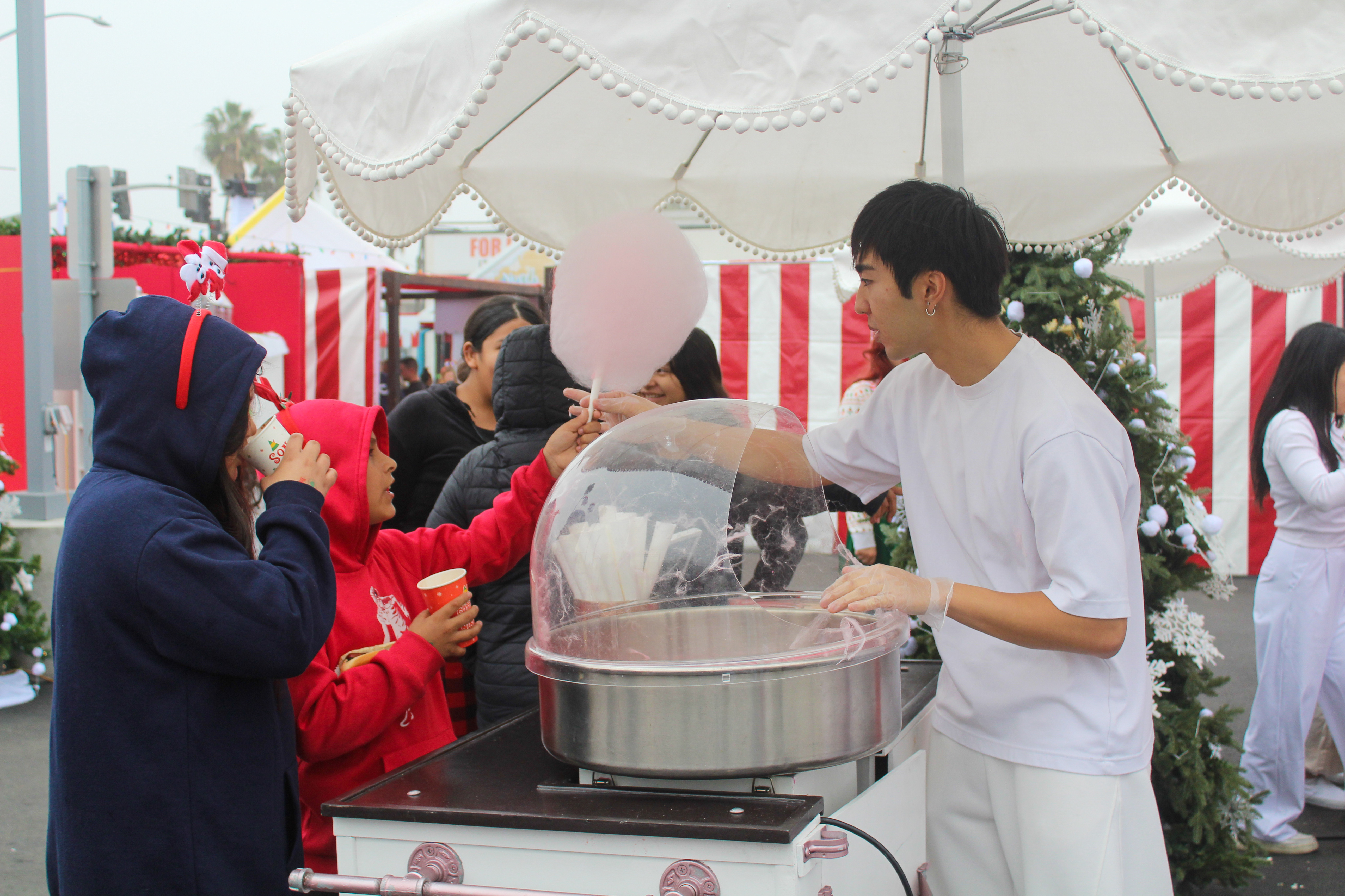 Children getting cotton candy at the Long Beach Rescue Mission’s...