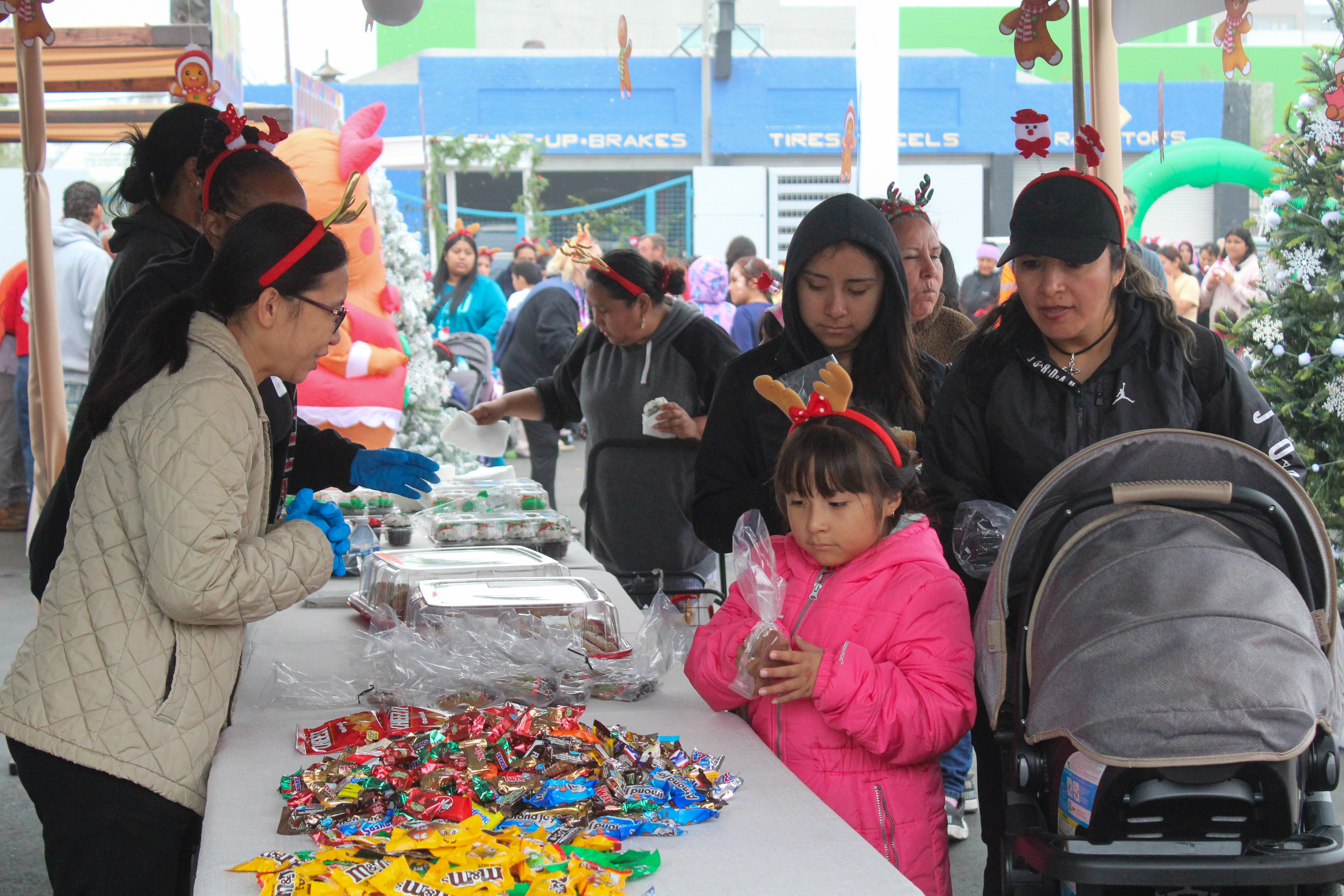 Hundreds of children and their families received food and drinks...