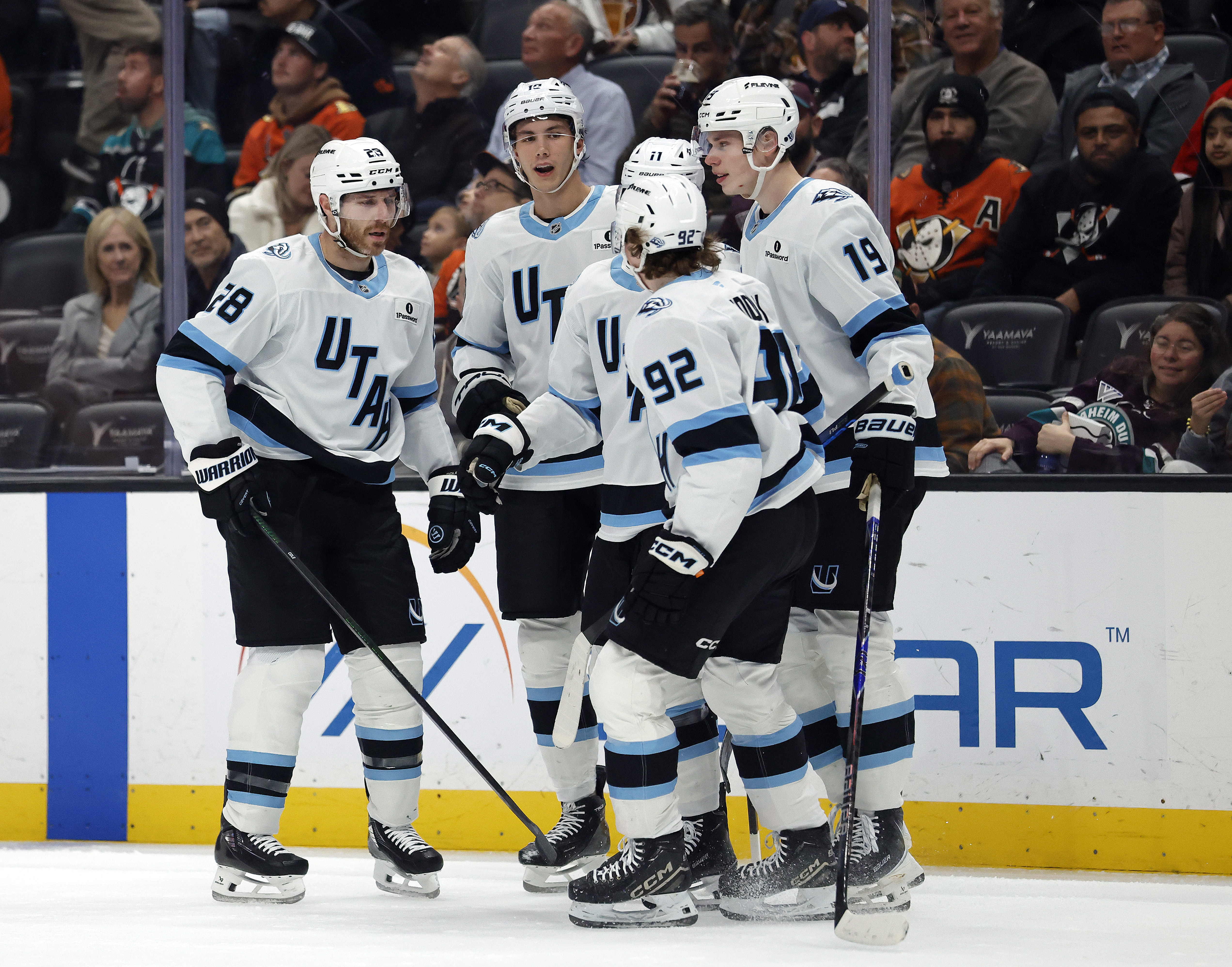 The Utah Mammoth’s Dylan Guenther (11) celebrates a goal with...
