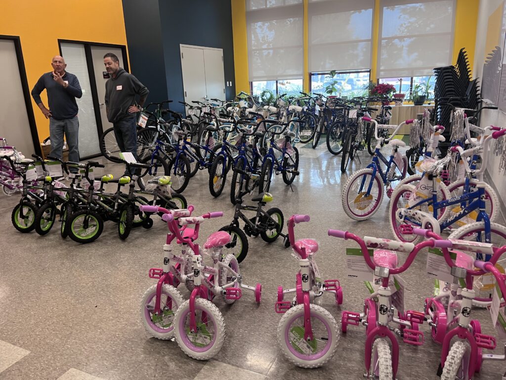 A room full of bicycles of various sizes for children and teens
