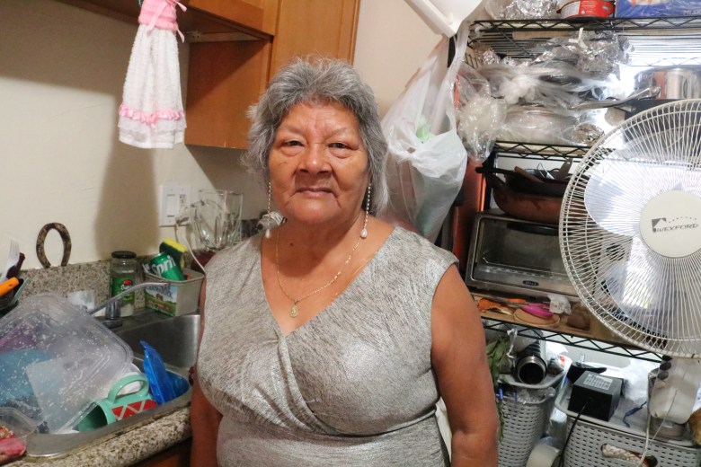 Maria Mendez, 67, poses for a photo inside her kitchen in East LA on Wednesday, Dec. 17, 2025.