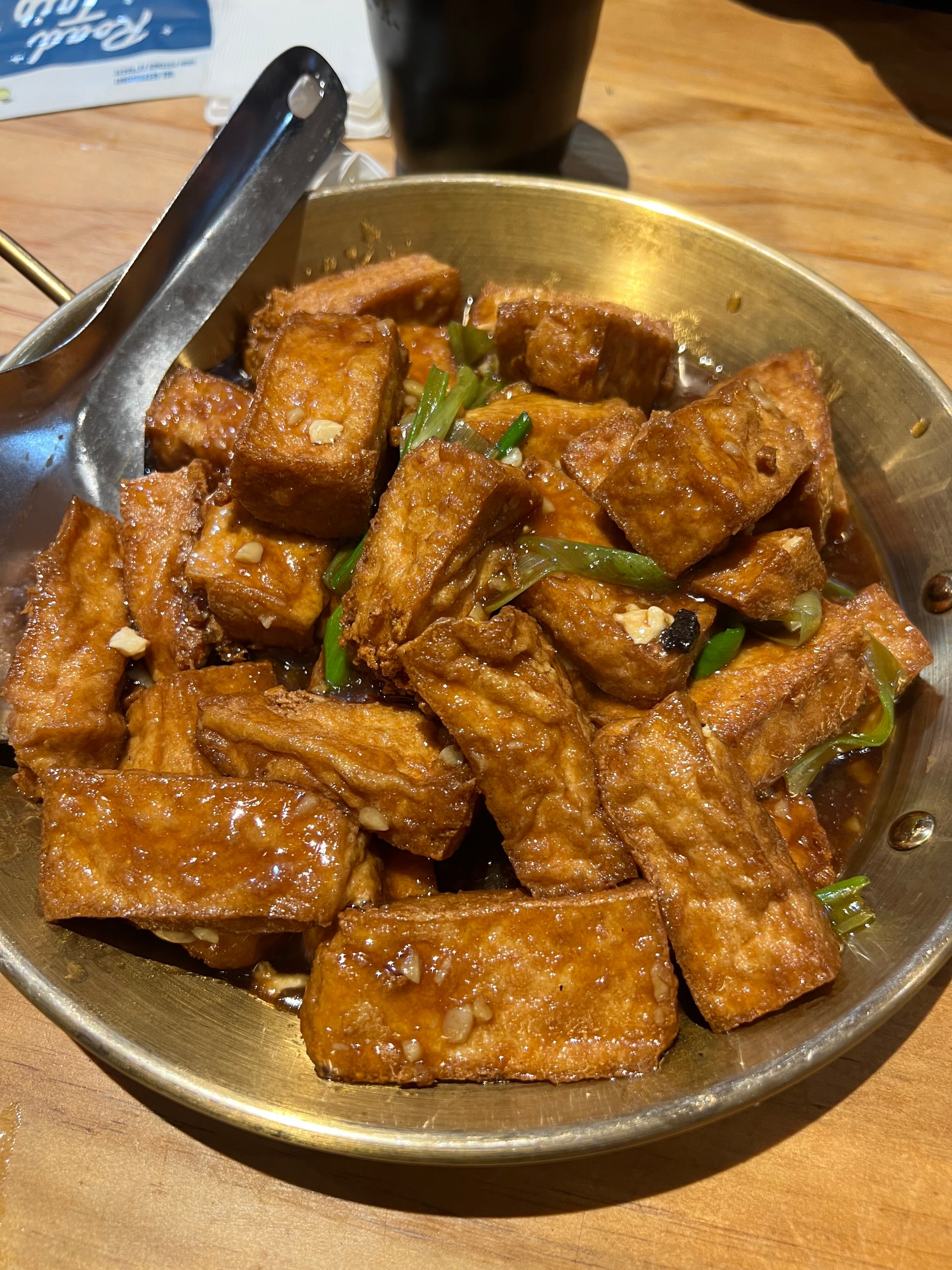 Cubes of tofu in a metal pan.