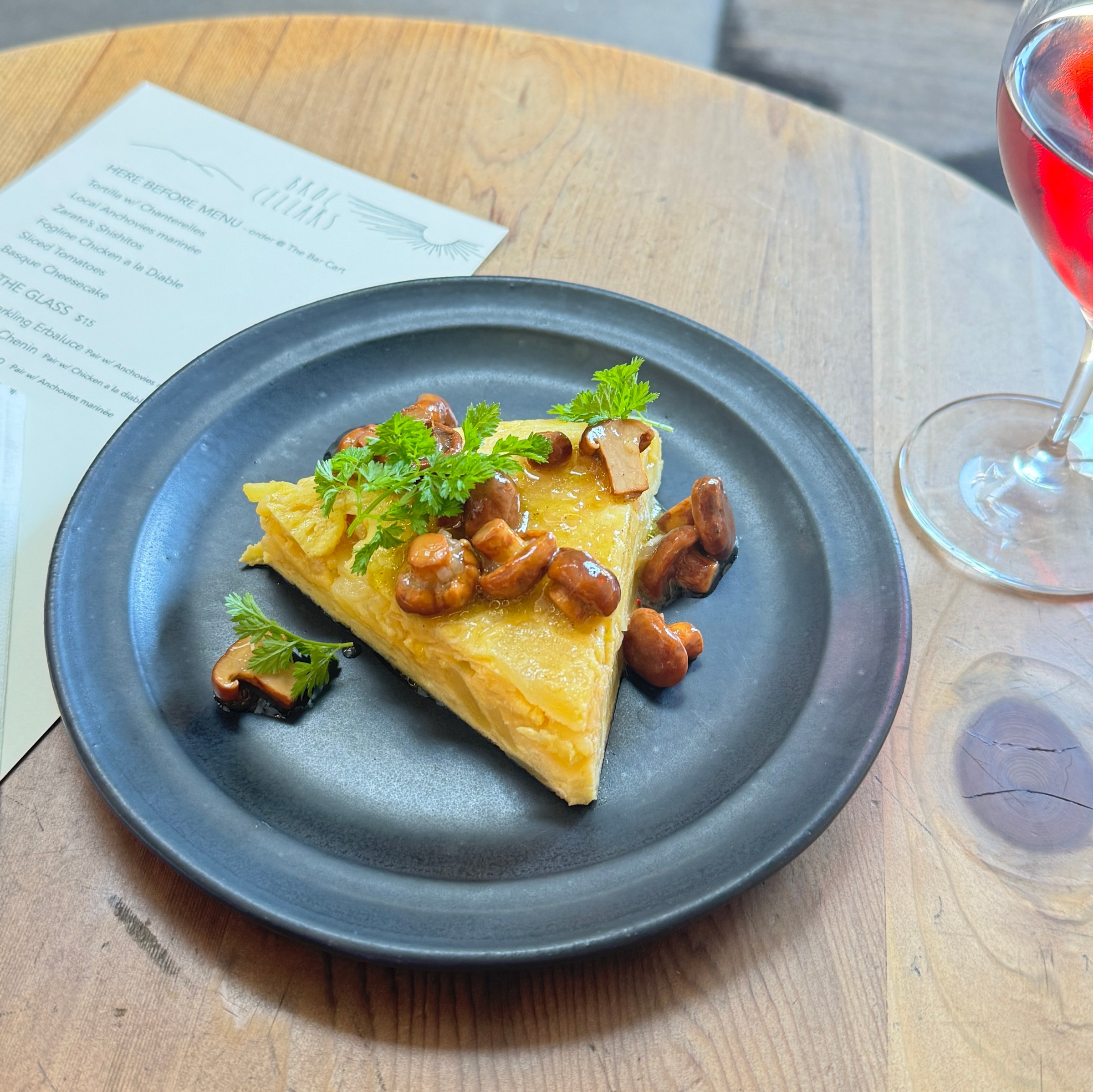 A Spanish tortilla with mushrooms on top from pop-up Here Before.