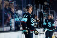 Seattle Kraken left wing Mason Marchment looks on before an NHL hockey game against the...