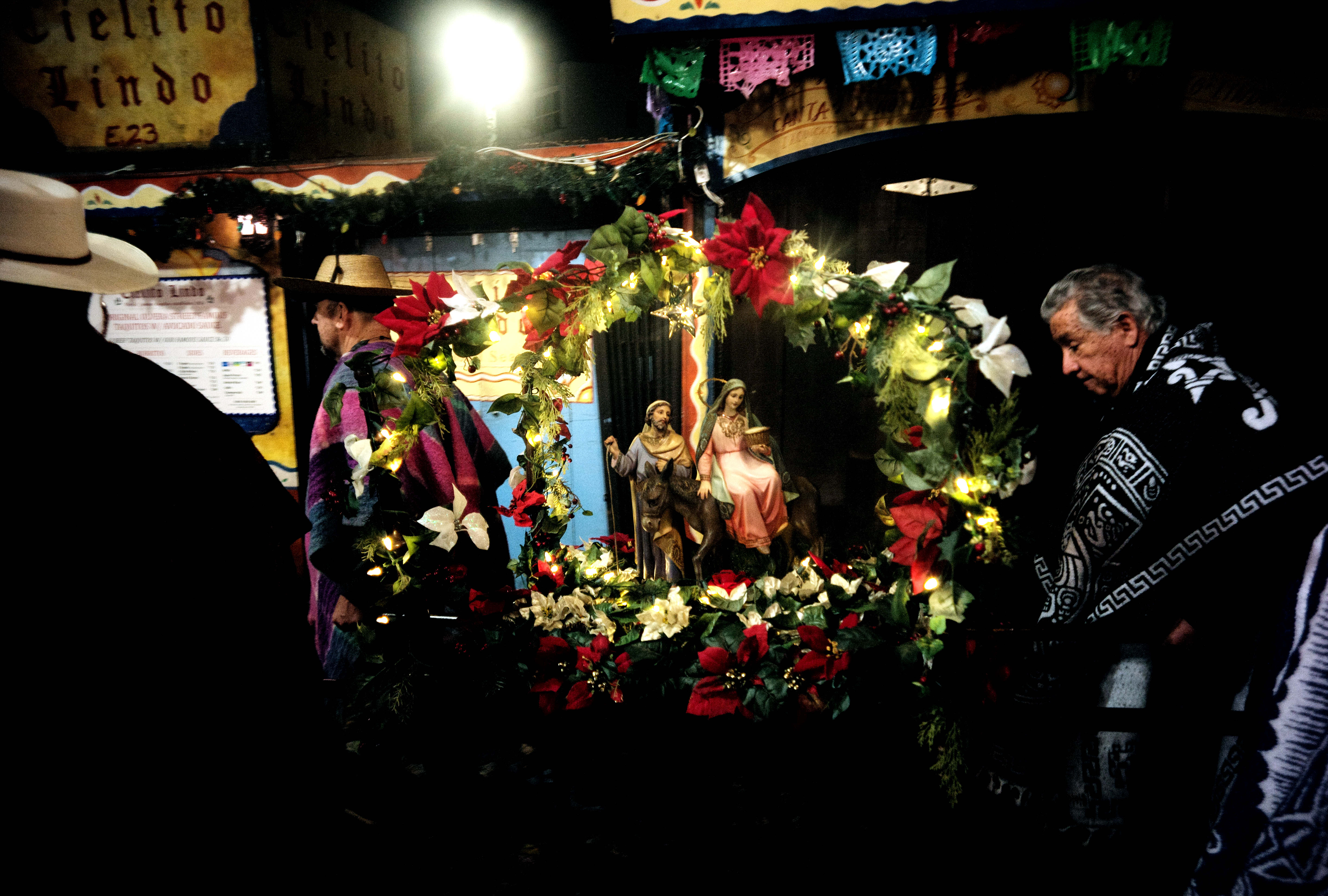 Las Posadas, reenacting the journey of Mary and Joseph to...
