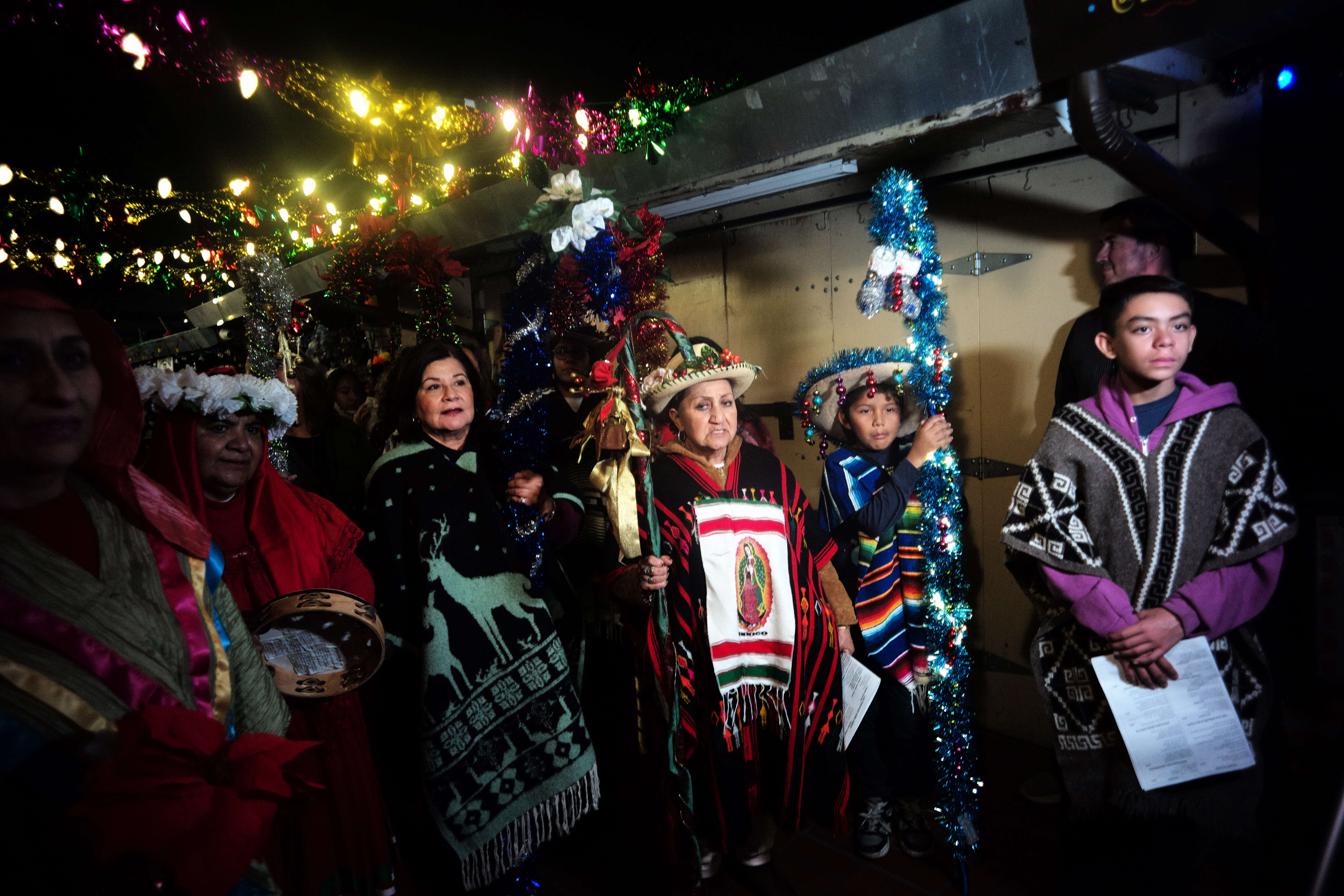 Las Posadas, reenacting the journey of Mary and Joseph to...