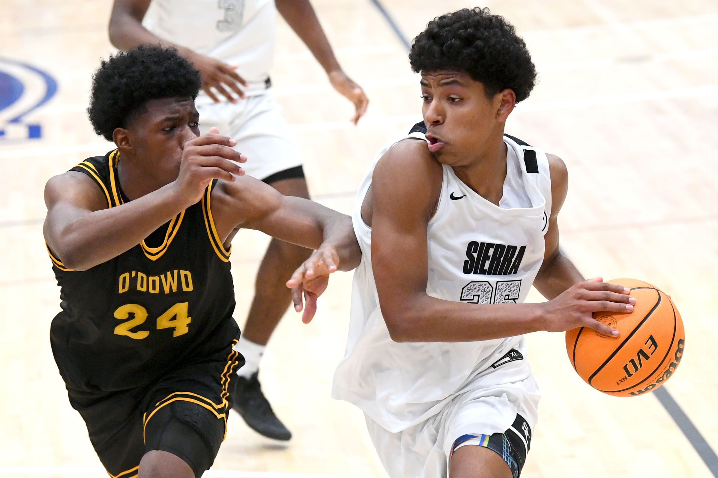 Sierra Canyonâs Josh Lowery (35) is guarded by gets by...