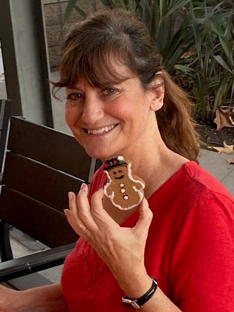 Retired teacher Vicky Brickman decorates cookies at Ronald McDonald House...