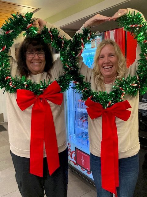 Volunteers Karen Denyer (left) and Jennifer Davis get into the...