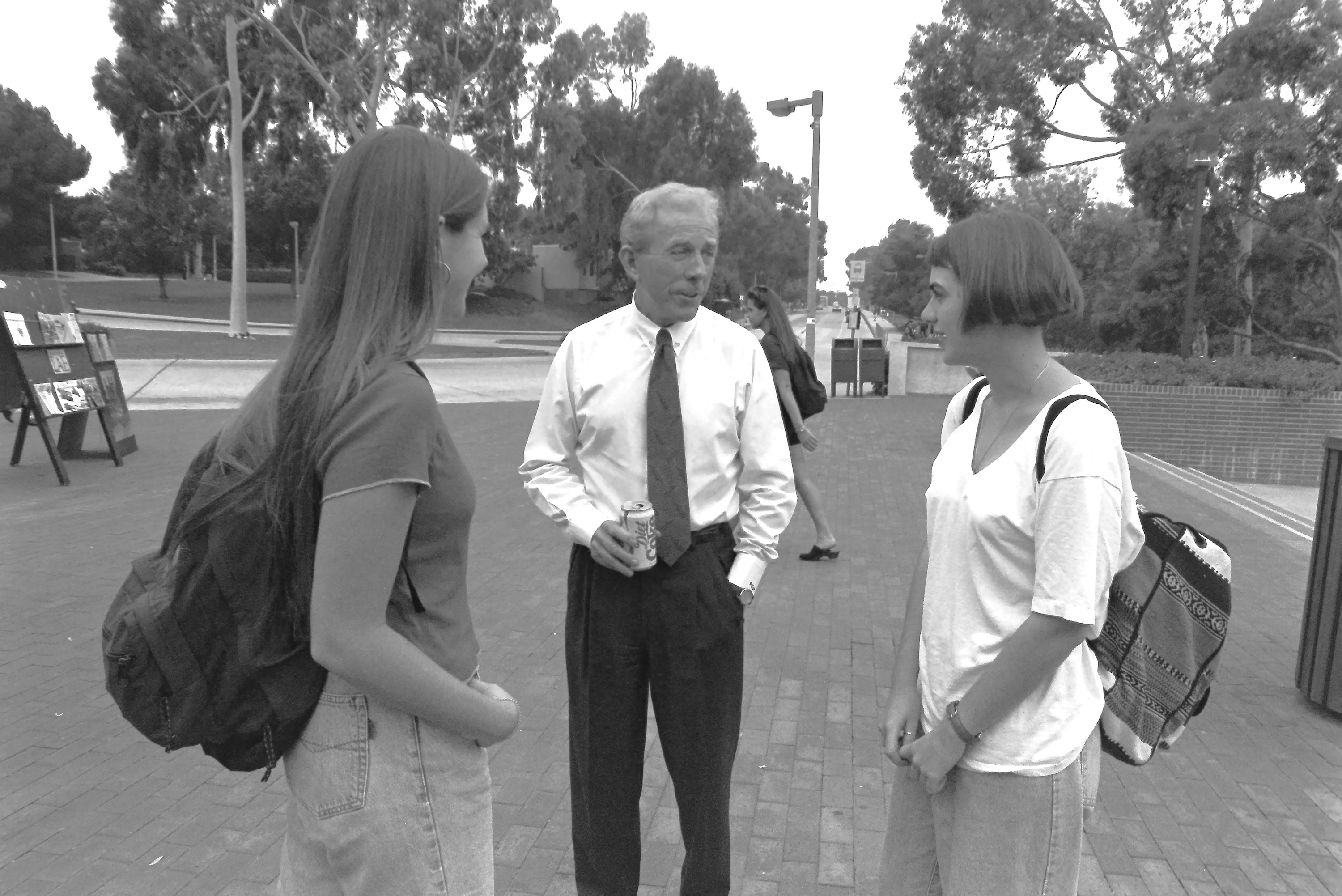 Legendary Cal State Long Beach President Bob Maxson, center, talks...