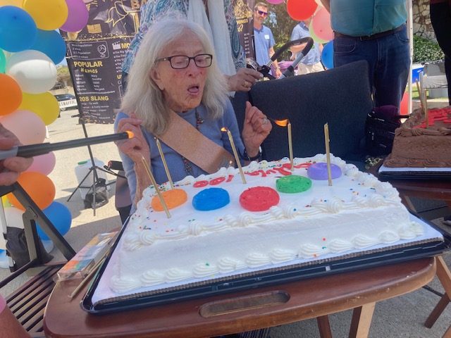 Sylvia Manheim blows out the candles celebrating her 100th birthday....