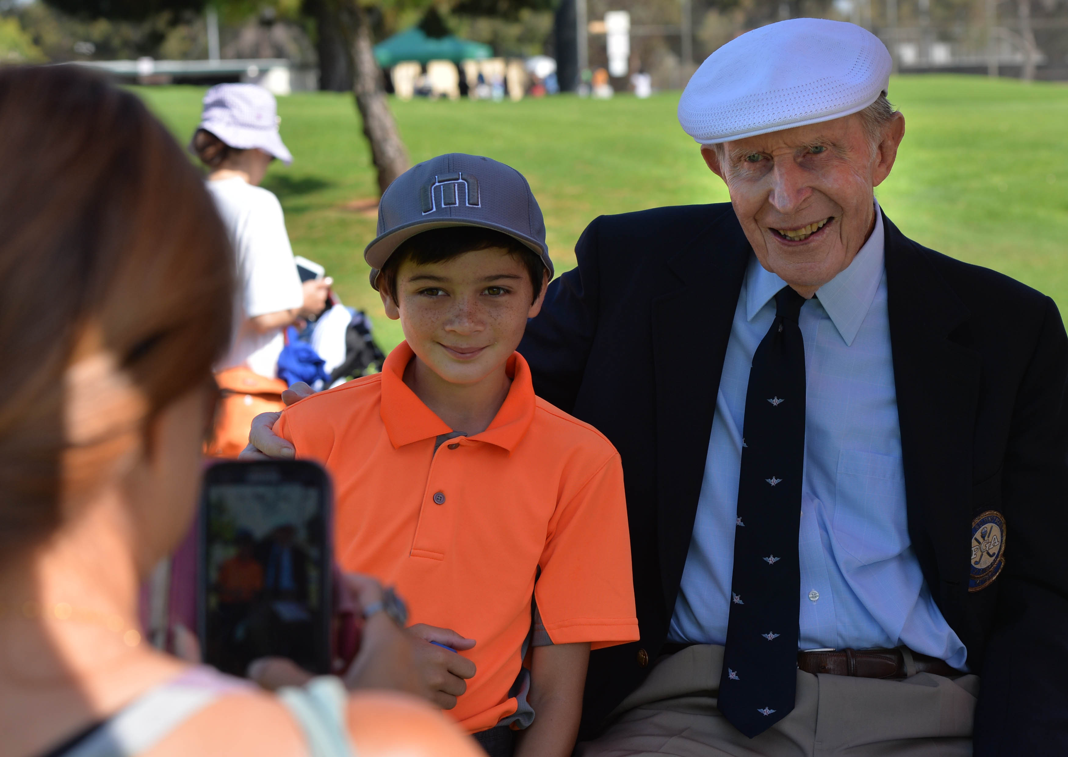 Matthew Schafer, 12, poses for a picture with Len Kennett...