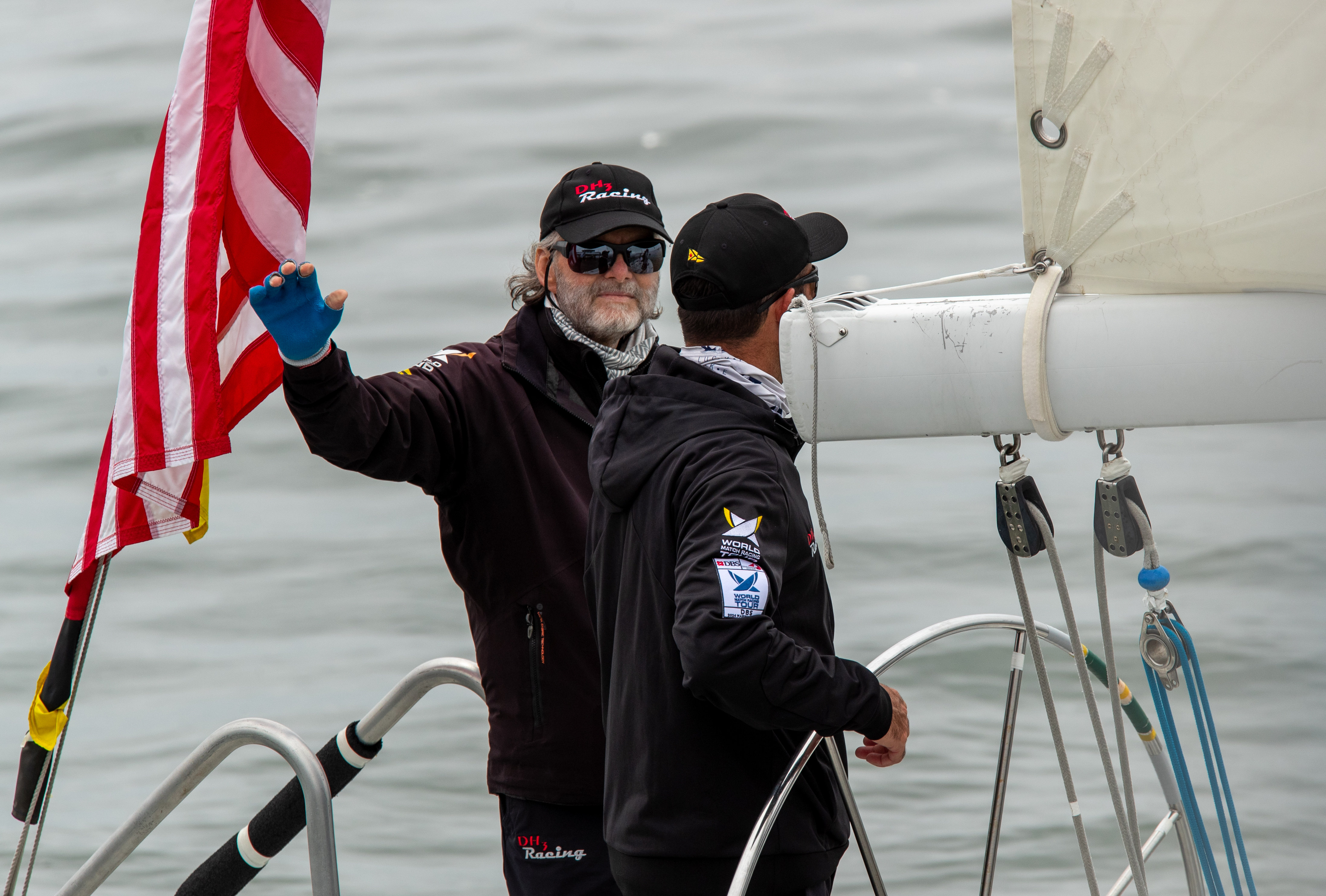Captain Dave Hood, from Long Beach, waves after winning his...