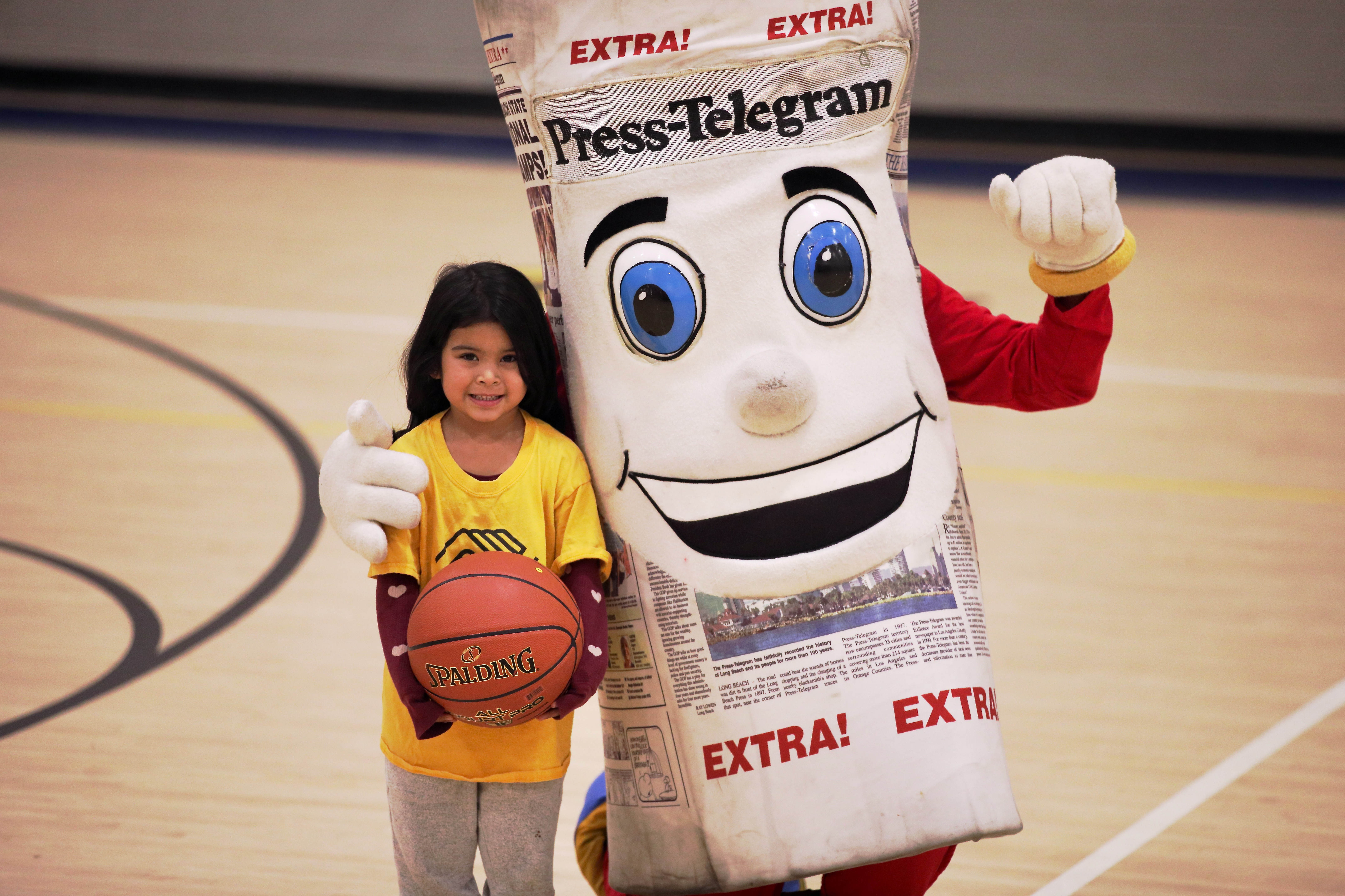 Elina Lainez, 6, gets a hug from Petey, the Press-Telegramâs...