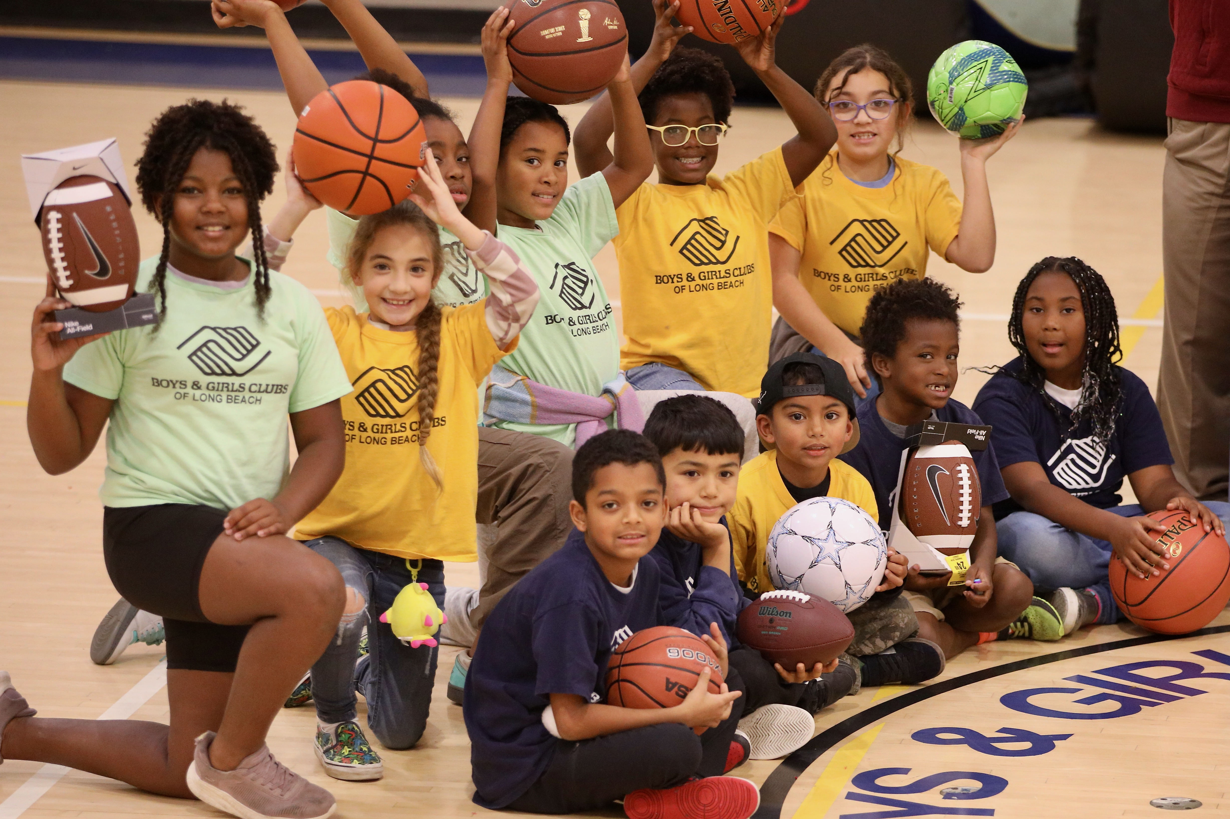 Members of the Long Beach Boys & Girls Club display...