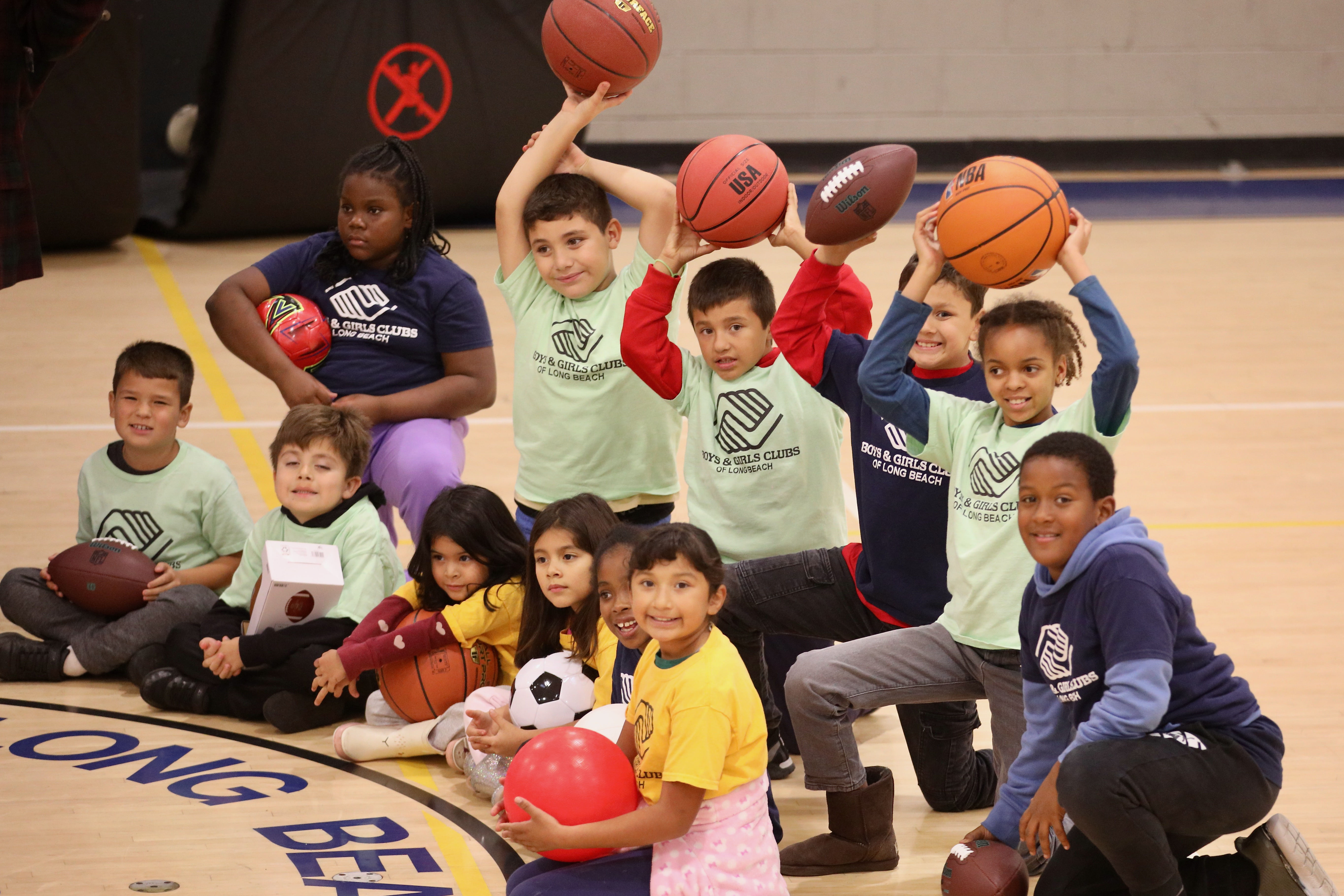 Members of the Long Beach Boys & Girls Club display...